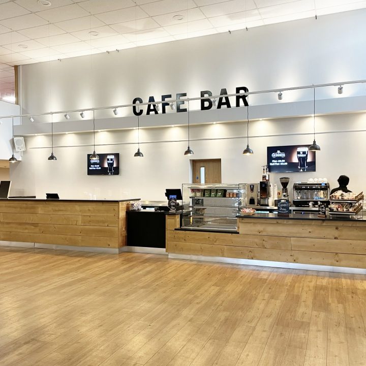 Spacious Gordon Craig café bar with light wooden floors.
