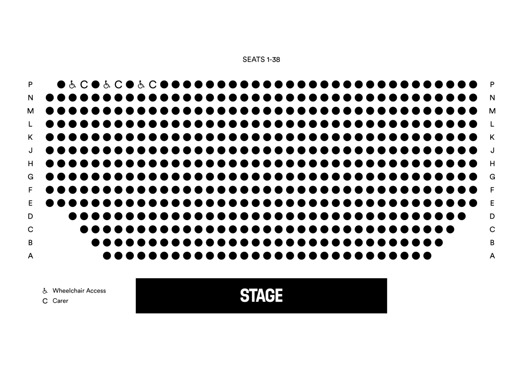 Dark auditorium with "STAGE" written on the floor in white text.